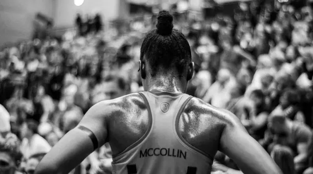 Athlete McCollin facing a stadium crowd