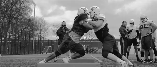 American football training in black and white