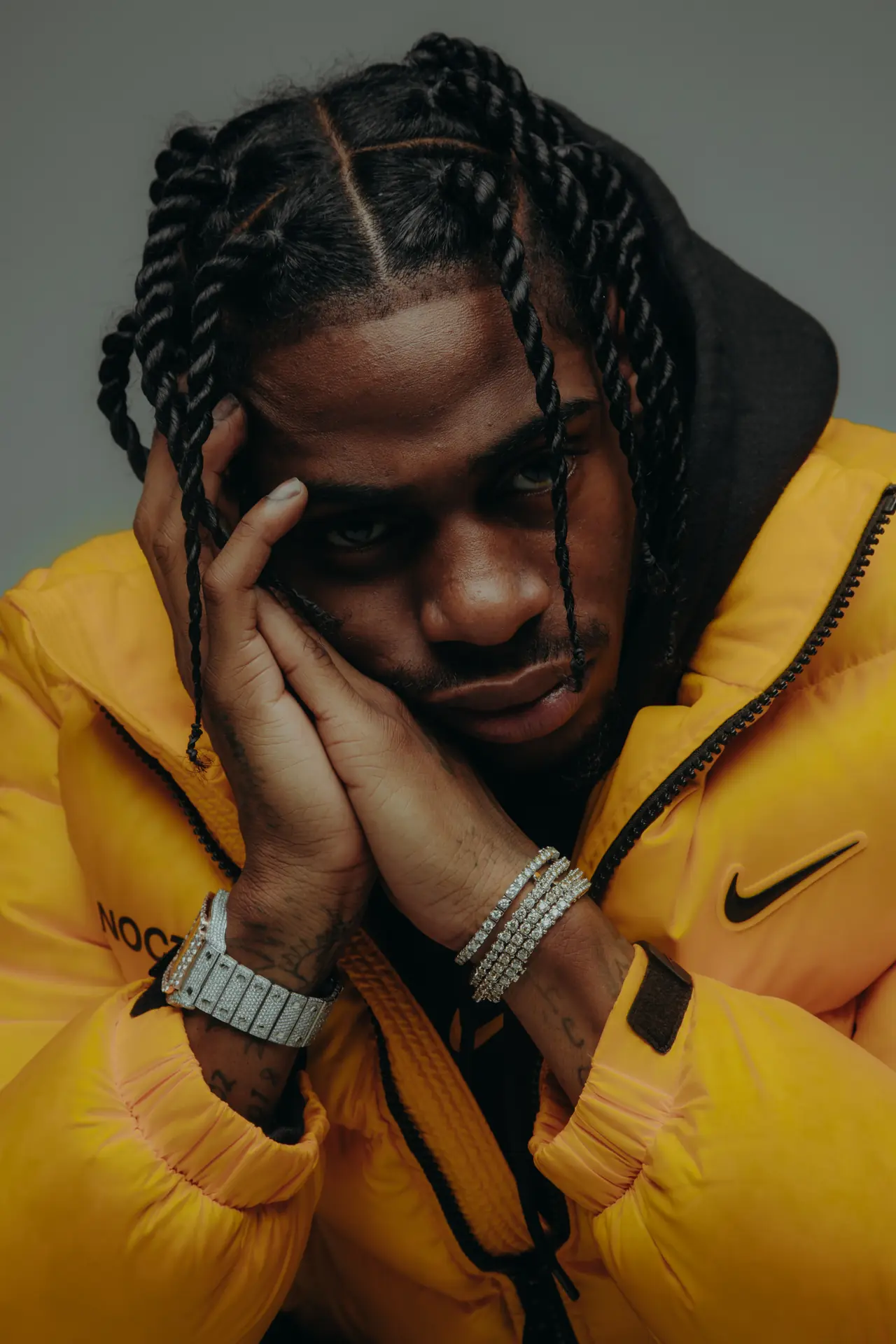 Artist portrait in a yellow puffer